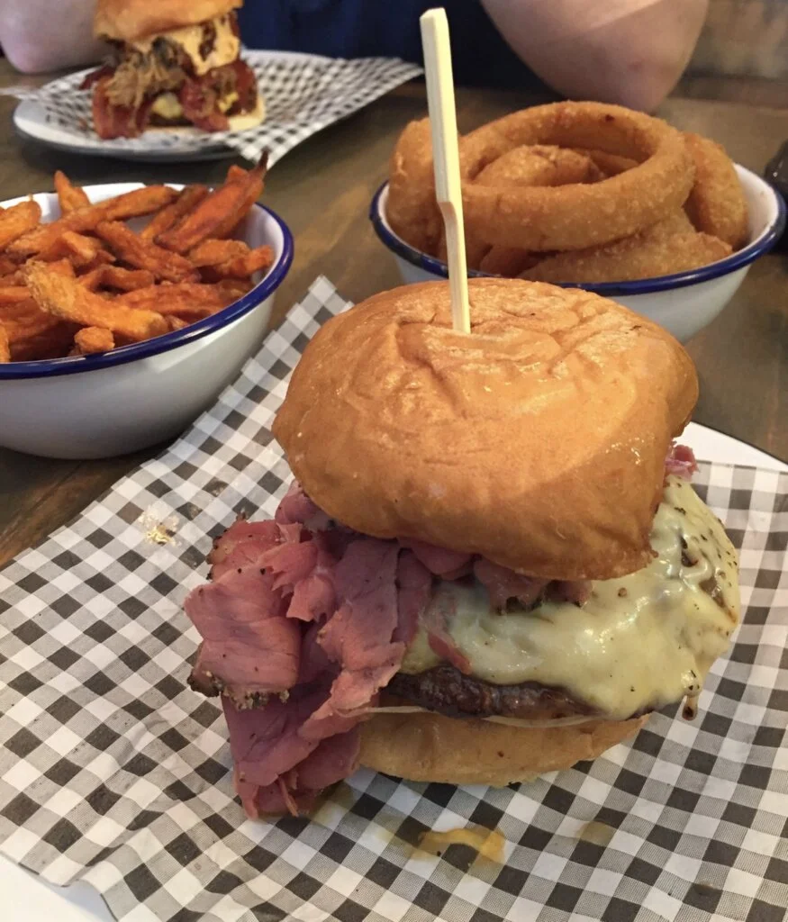 burger on white checked paper
