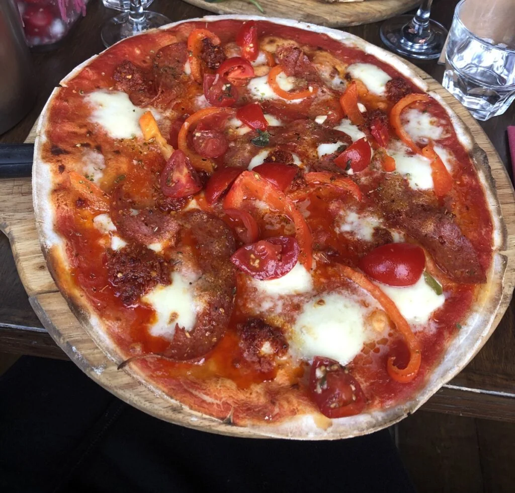 Pizza on table at origano, edinburgh