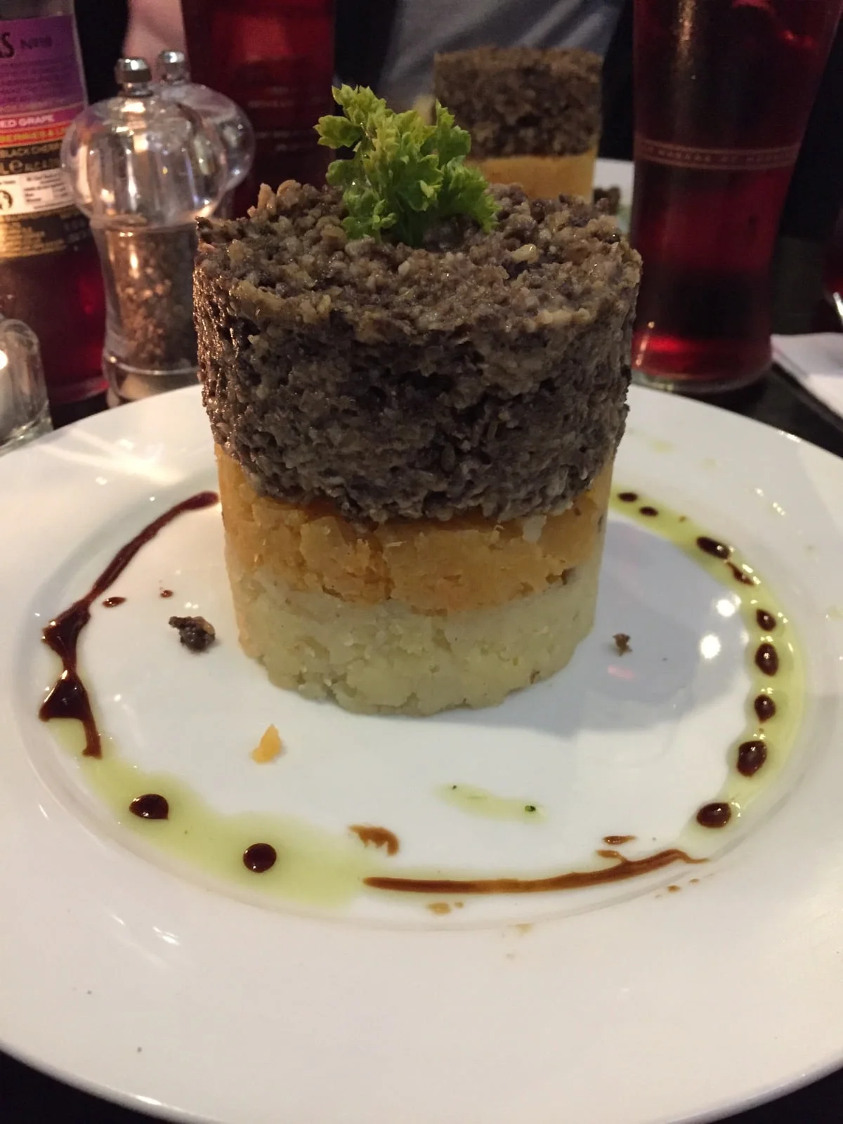 Gluten free haggis on white plate