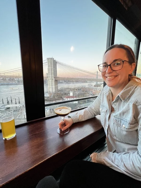 Picture at bar with brooklyn bridge in the background
