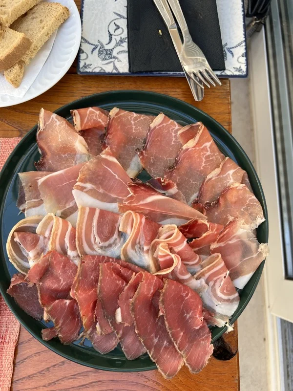 cold meat charcuterie on black plate